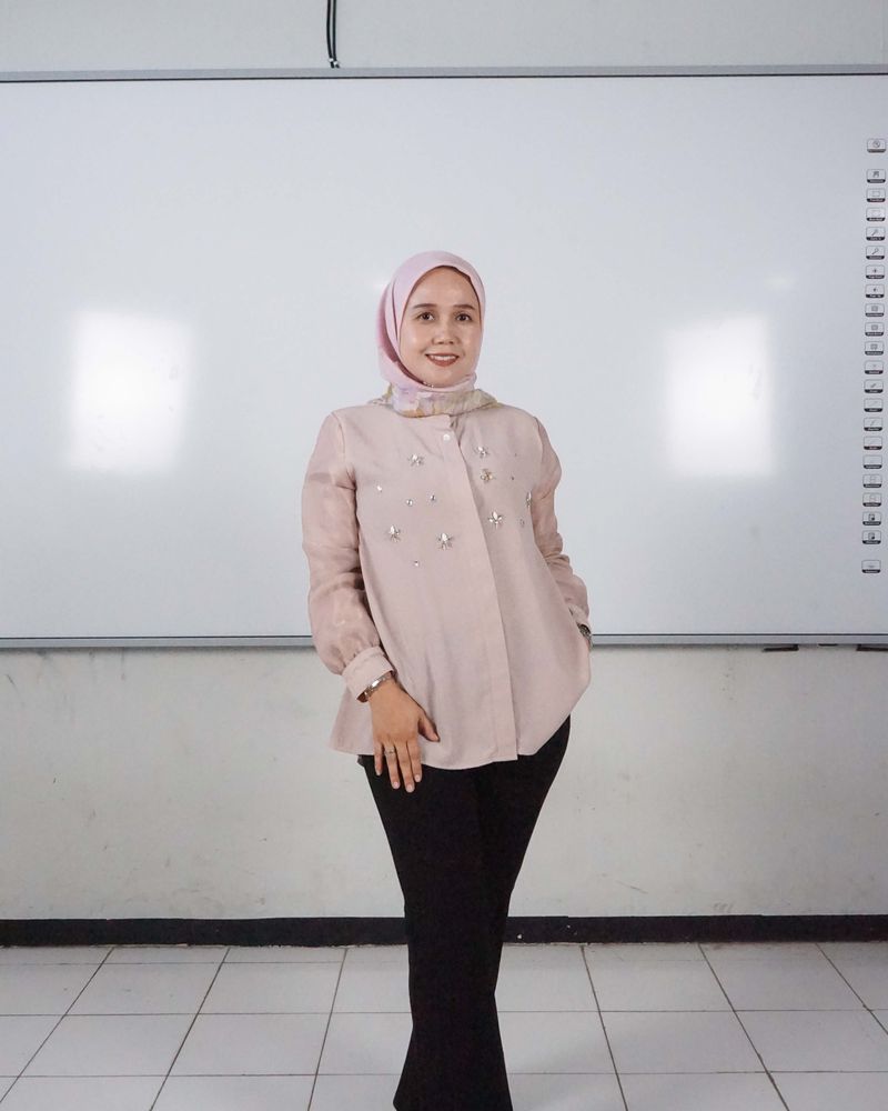 Evita Nuraini, S.Pd.